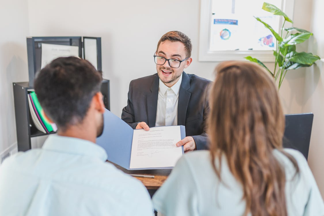 an attorney guiding a couple about bankruptcy alternatives to consider