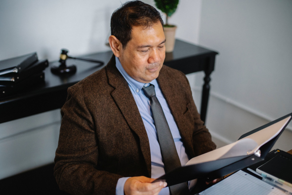 A debt settlement lawyer reviewing a document.