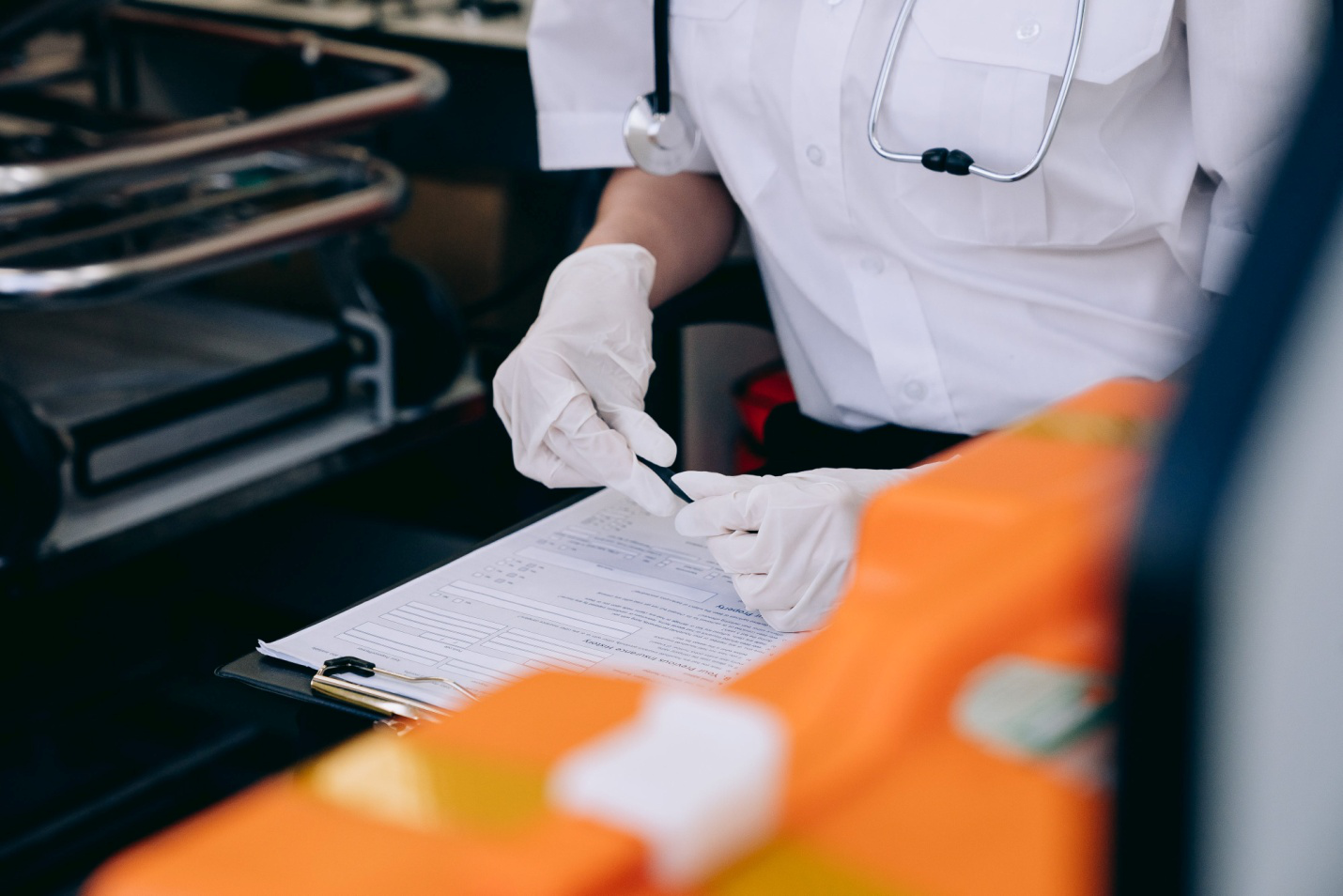 A medical professional reviewing a form.