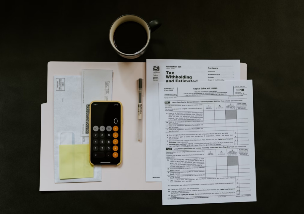 A cup of coffee and some papers on the table