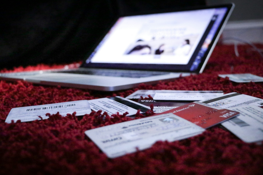 Unpaid bills and laptop on a carpet