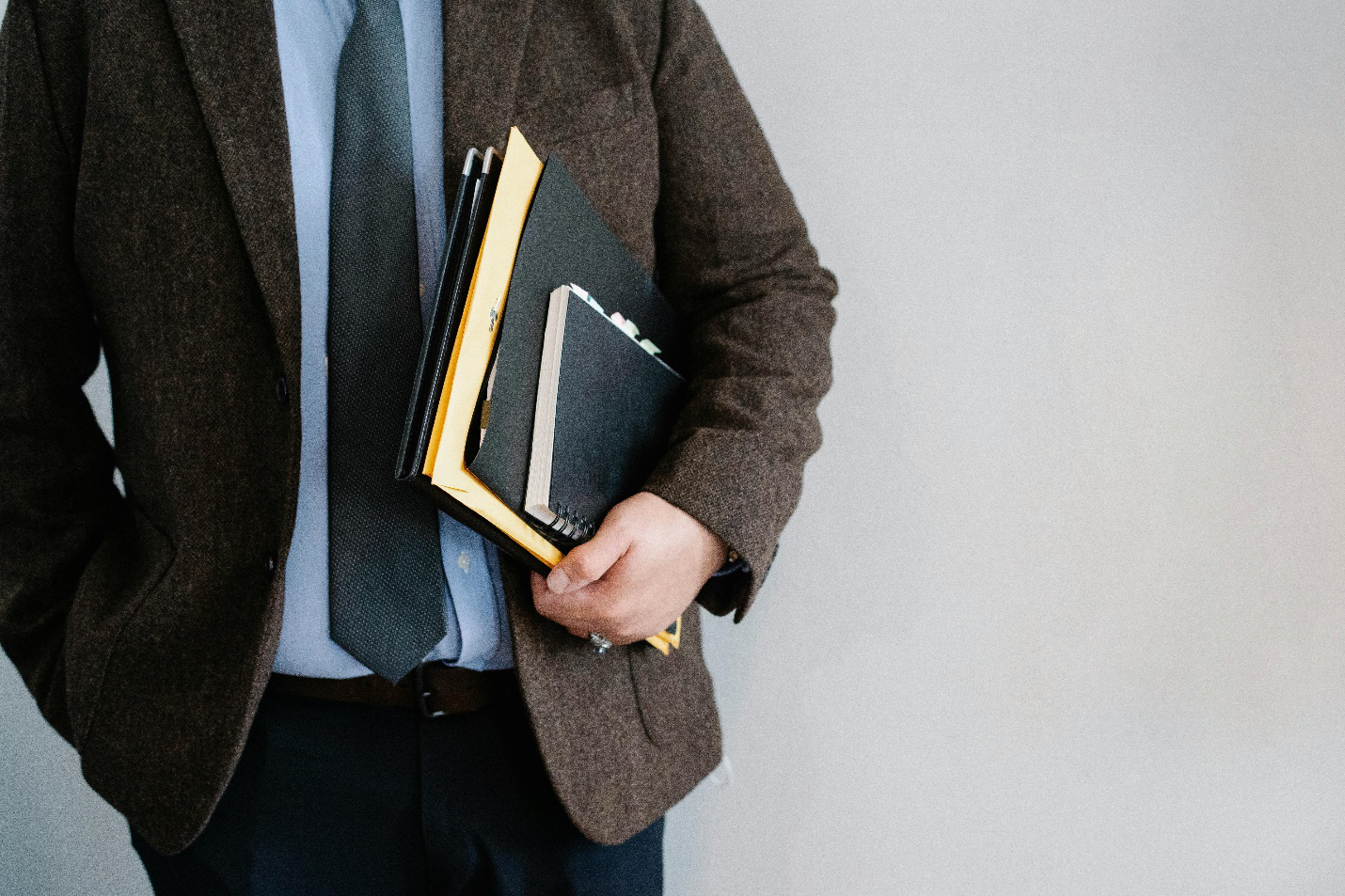 An attorney holding files.