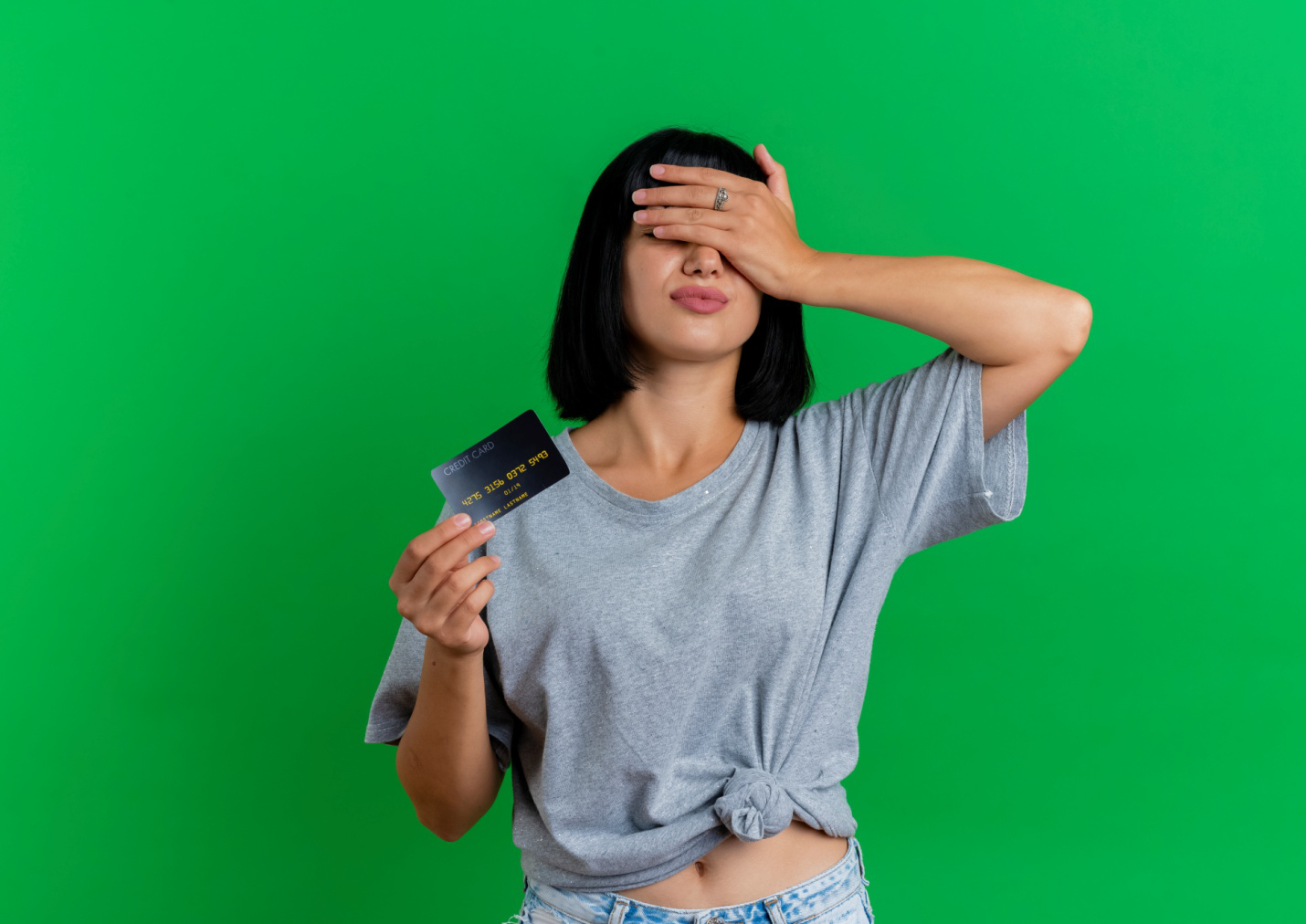 A woman holding a credit card