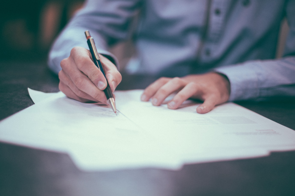 Lawyer signing papers