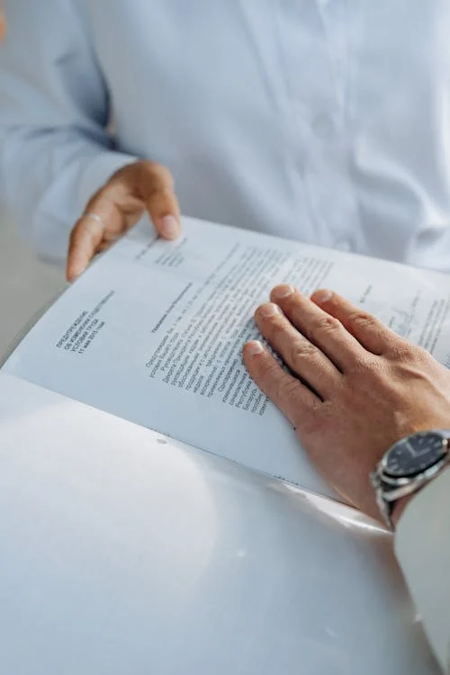 A signed contract with a pen symbolising agreement and legal commitment