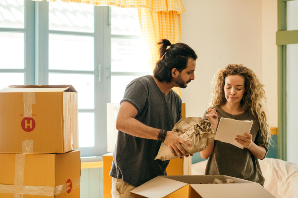 A couple moving out from a house