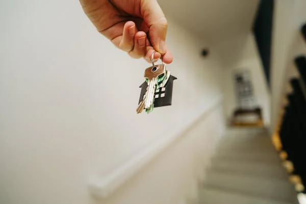 a man holding his house keys