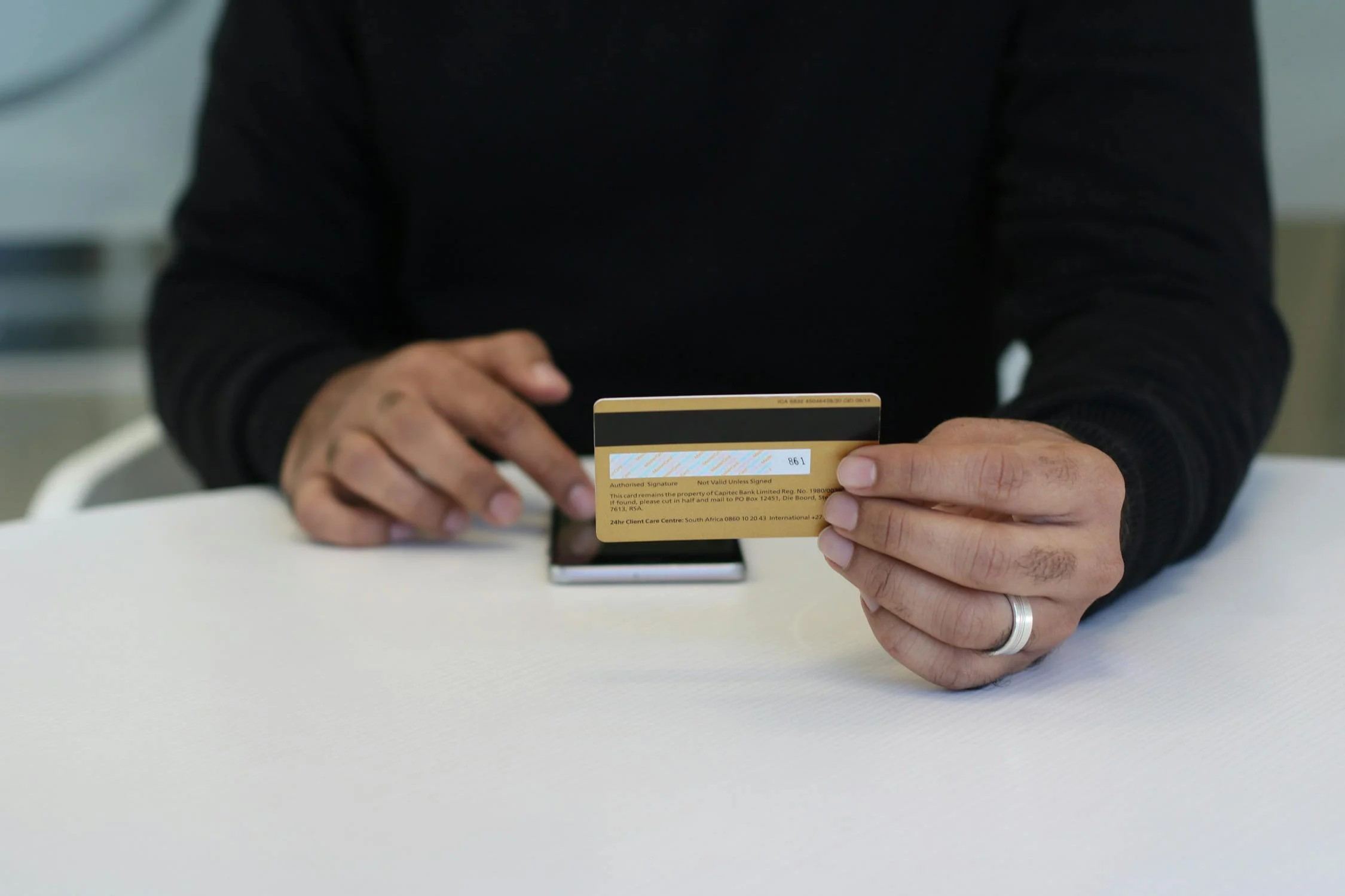 A person holding a credit card