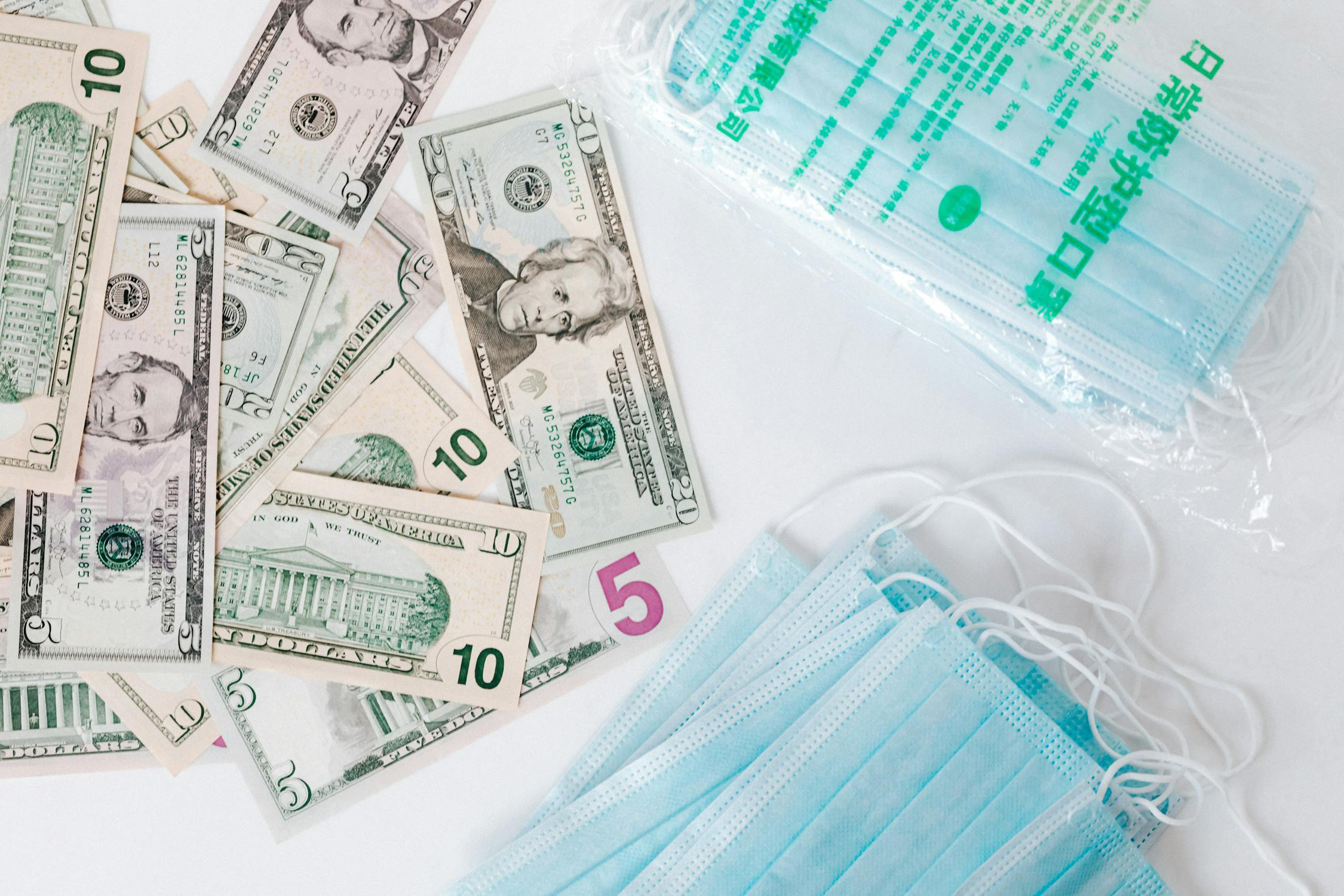 Cash next to medical masks