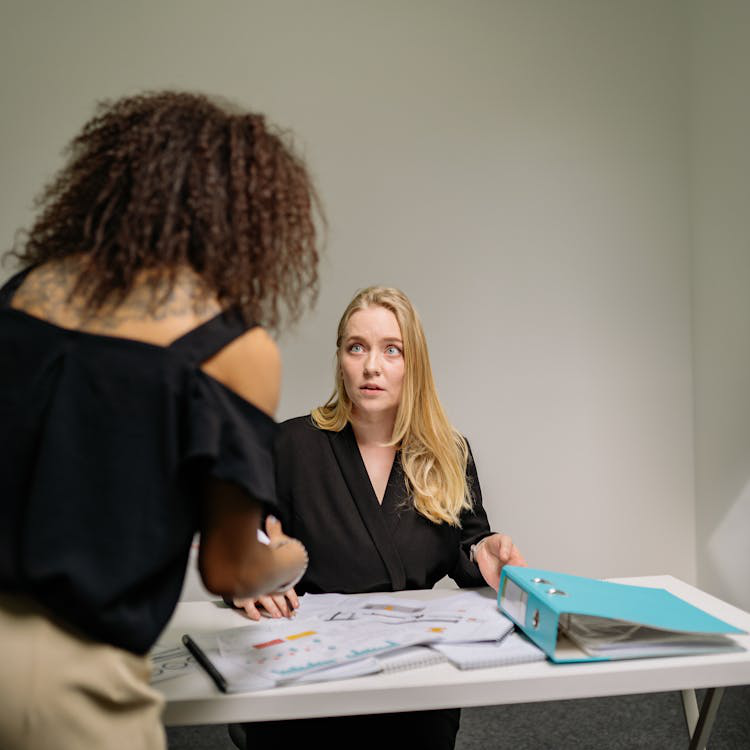 attorney and client reviewing paperwork