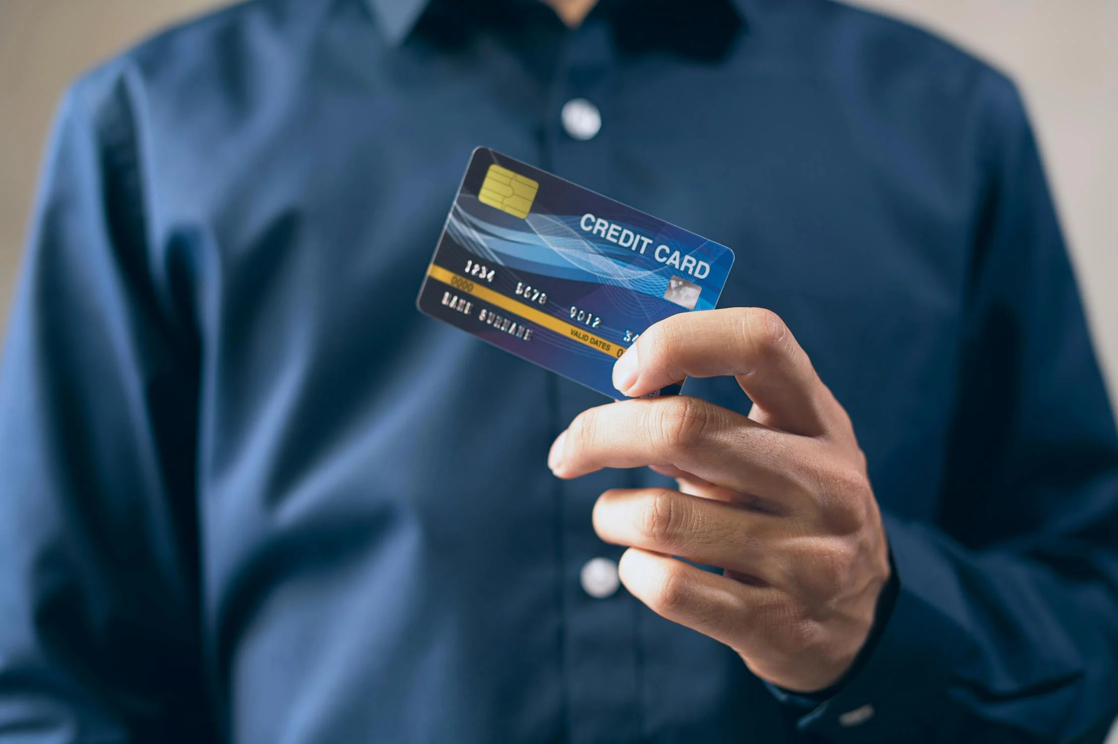 A person holding a credit card