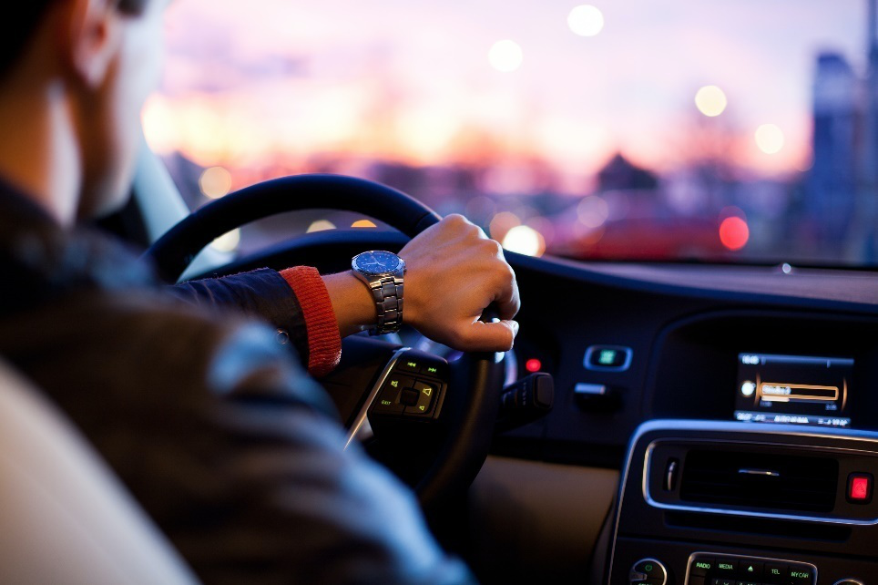 A person is driving their car