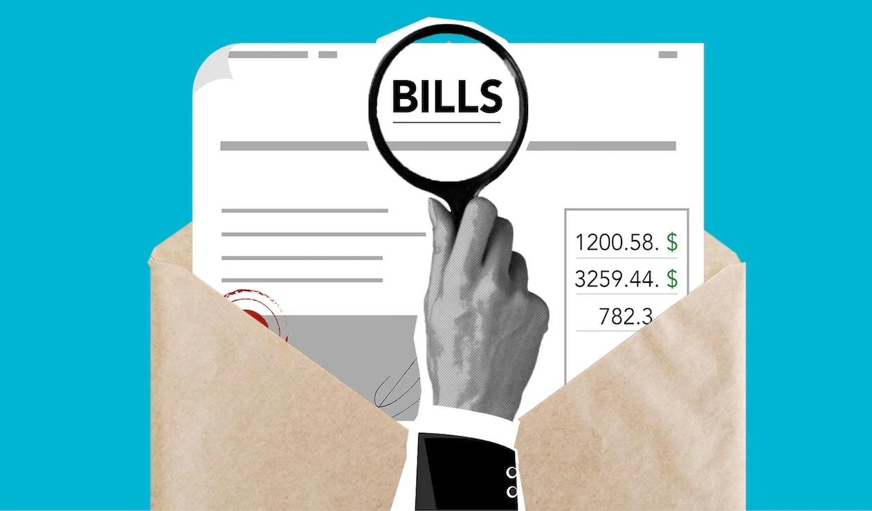 bills under a magnifying glass