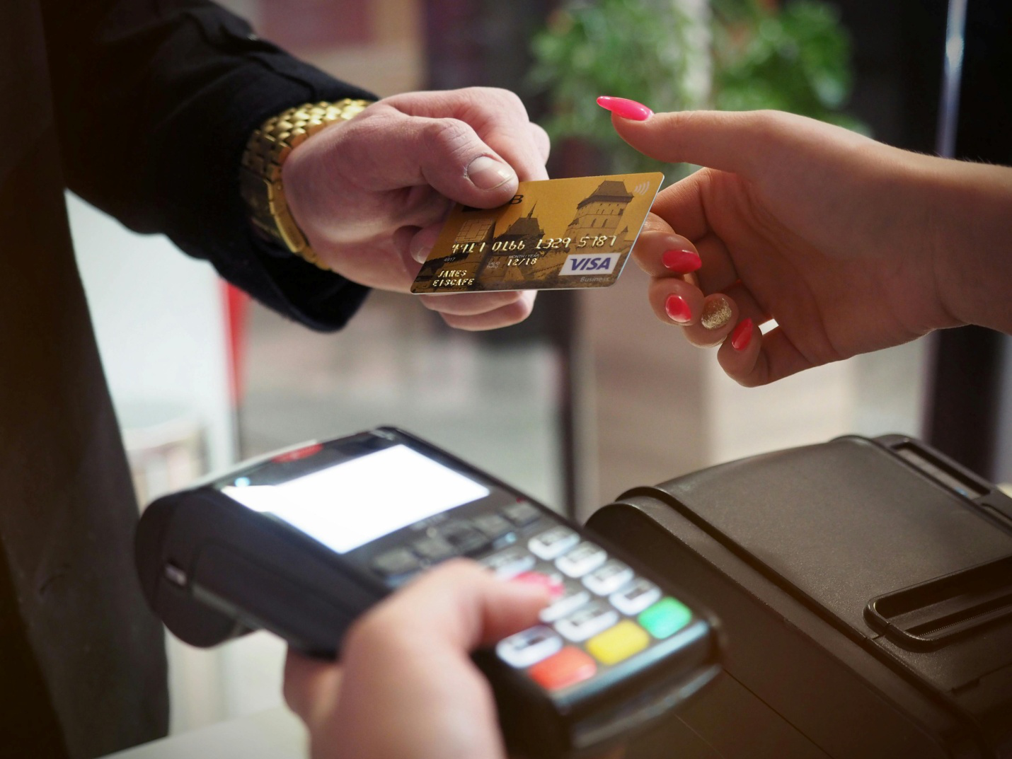A person making a payment through a credit card