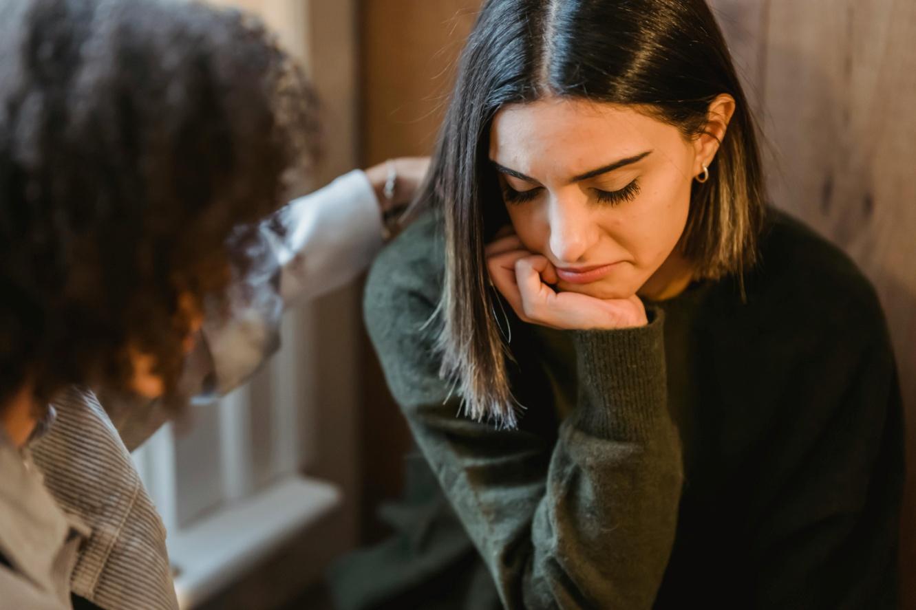 A person consoling another person