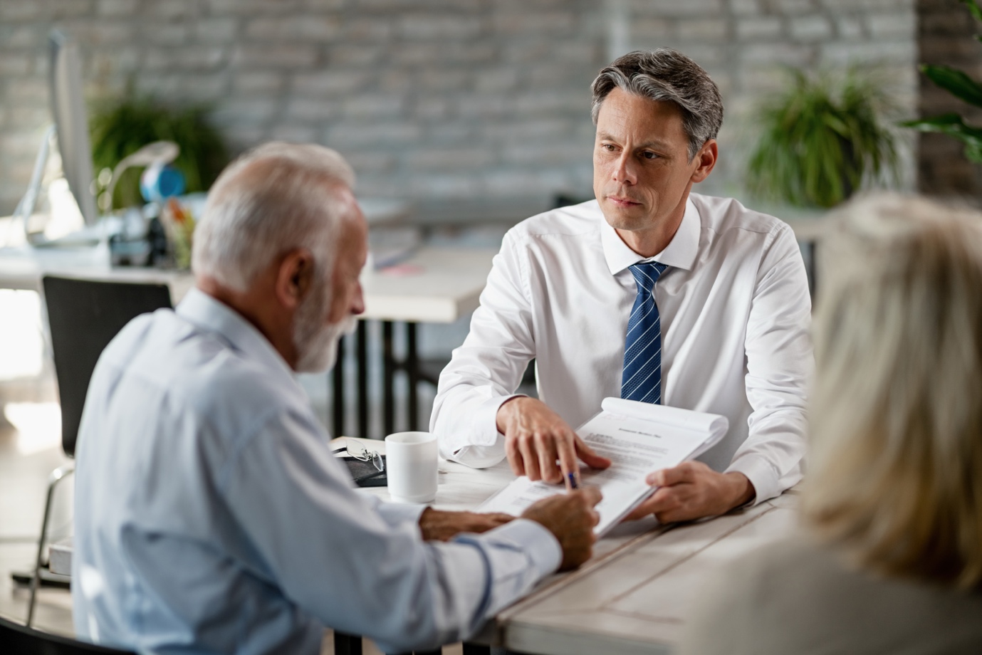 Texas repossession lawyer reviewing contract details with a client