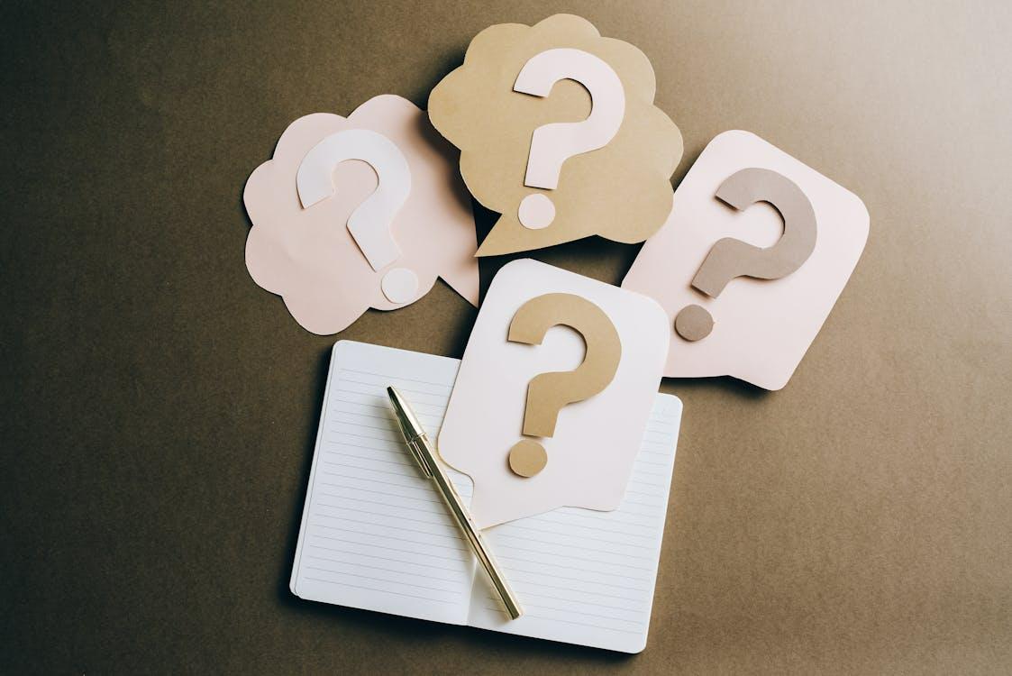 Question marks on paper