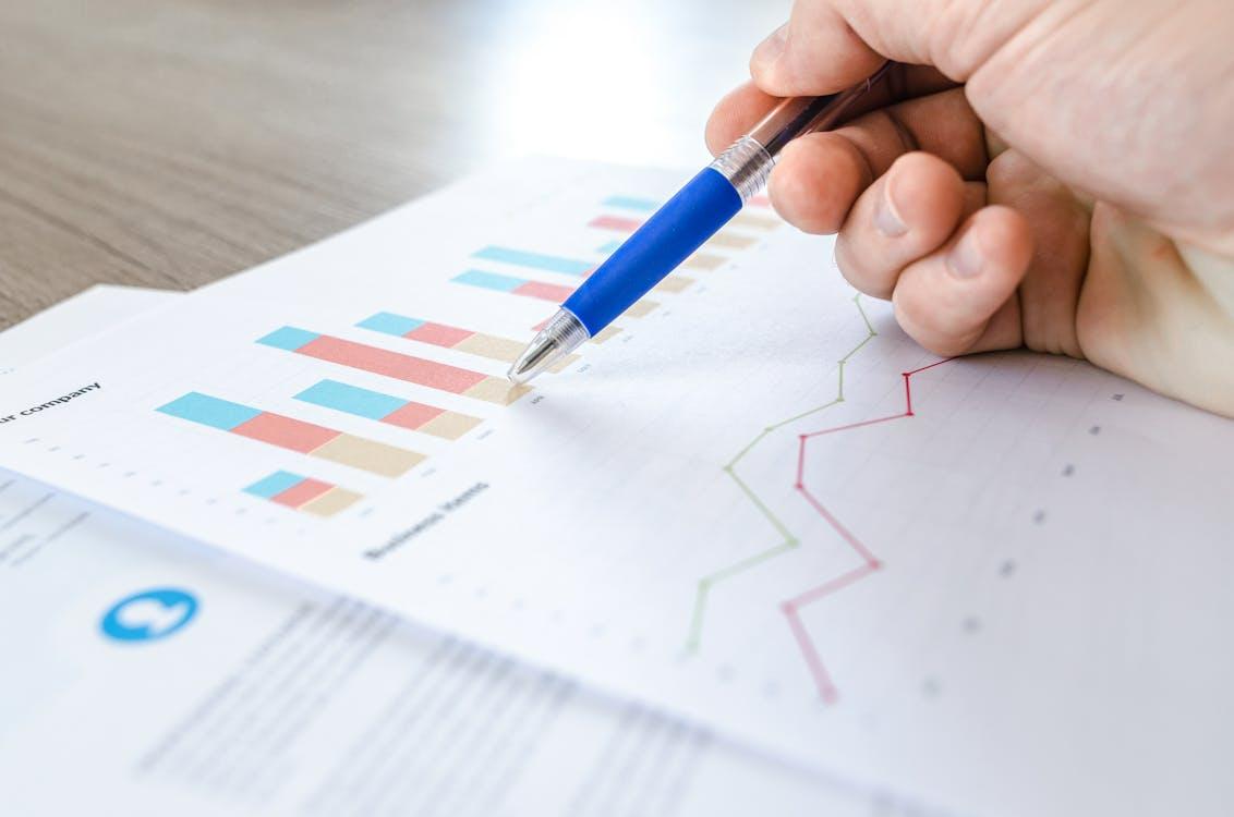 Person reviewing charts and graphs