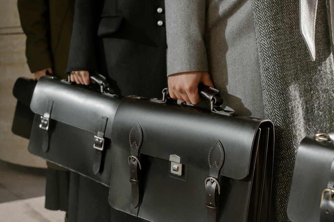 Lawyers in professional attire holding a briefcase, prepared to assist clients in achieving financial freedom