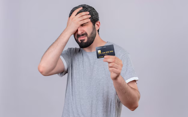 A man holding a credit card