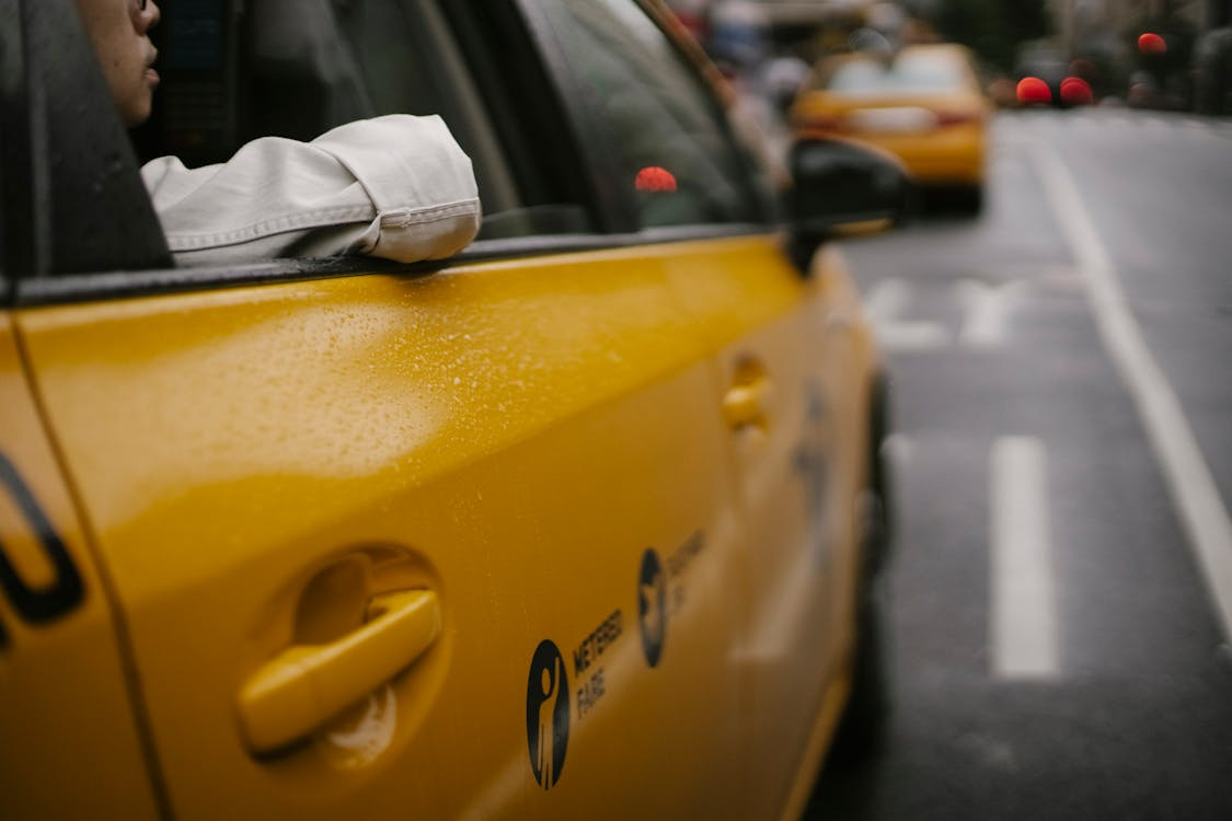 a person sitting in a taxi