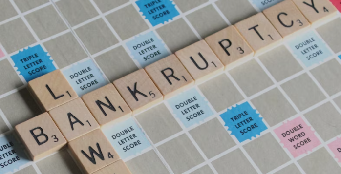 This image shows Scrabble blocks of the word bankruptcy.