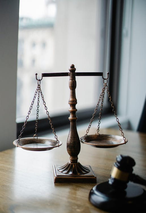 close-up of a scale and gavel in a lawyer's office