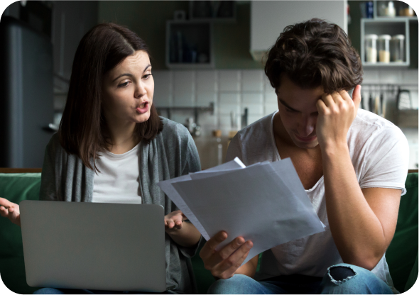 A person holding a piece of paper next to a woman.