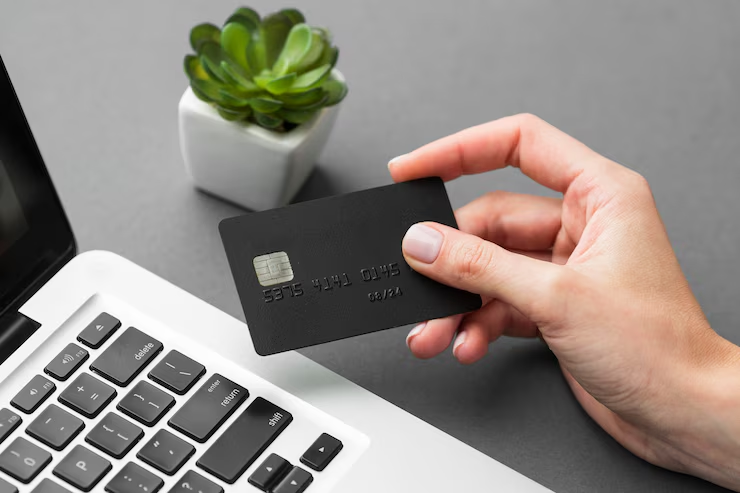 A person holding a credit card