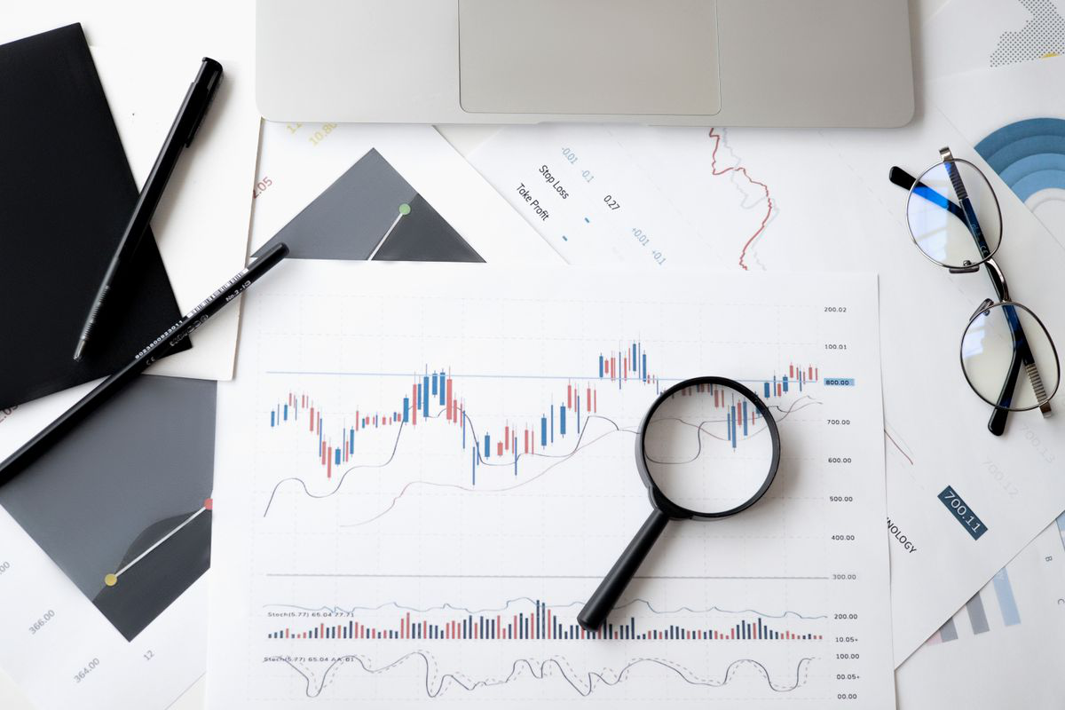  Financial papers, charts, notebook, and glasses arranged on a desk Image Caption: Organized financial records can make future creditor communications easier to track